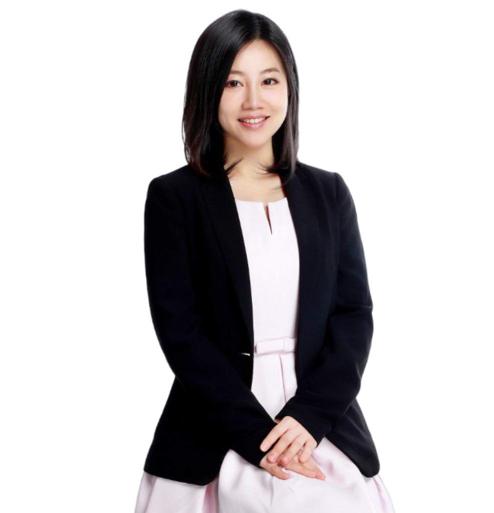 an asian lady with a black suit and pink blouse.